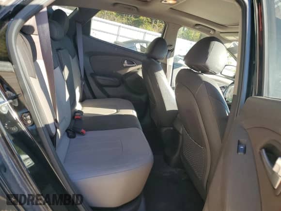 2011 Hyundai Tucson GLS z VIN KM8JU3AC0BU142391, wystawiony jako Copart lot #77628954 z przebiegiem 117 081 mil mil oraz Szkoda całkowita • Salvage title. Historia ofert i sprzedaży dostępna na DreamBid. Obrazek 11.