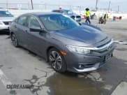 ✅ 2018 Honda Civic EX-T • VIN: JHMFC1F38JX020125 • Lot: 42342438. Listed on IAAI with 115,037 mi. Free auction sales archive from the USA and detailed vehicle history report at DreamBid. Image 1.