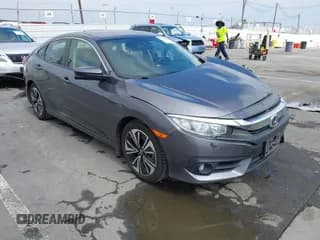 ✅ 2018 Honda Civic EX-T • VIN: JHMFC1F38JX020125 • Lot: 42342438. Listed on IAAI with 115,037 mi. Free auction sales archive from the USA and detailed vehicle history report at DreamBid. Image 1.