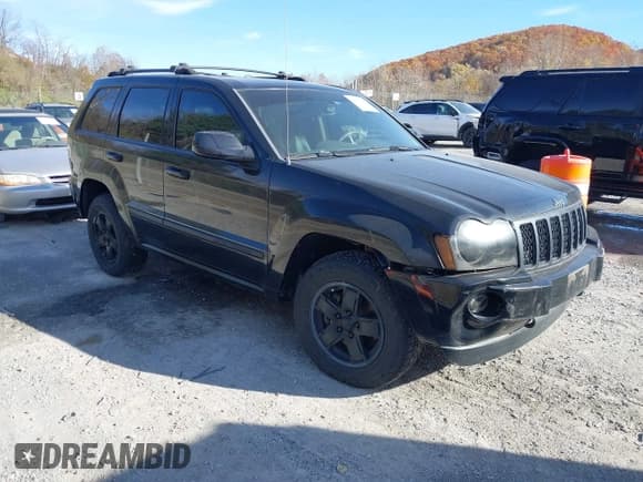 ✅ 2007 Jeep Grand Cherokee Overland • VIN: 1J8HR68277C601487 • Lot: 43606710. Listed on IAAI with 245,137 mi. Free auction sales archive from the USA and detailed vehicle history report at DreamBid. Image 1.