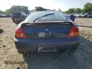 2004 Hyundai Tiburon с VIN KMHHM65D74U139333, выставлен на аукционе Copart как лот 61754235 с пробегом Не указан миль и Списание • Salvage title. История ставок и продаж доступна на DreamBid. Изображение 6.