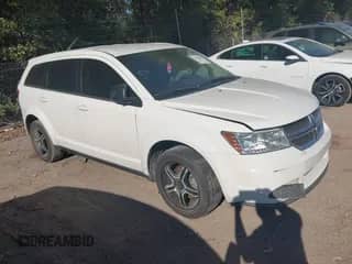 2015 Dodge Journey American Value z VIN 3C4PDCAB2FT619988, wystawiony jako IAAI lot #43458607 z przebiegiem 320 688 mil mil oraz . Historia ofert i sprzedaży dostępna na DreamBid. Obrazek 1.