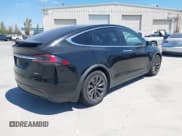 ✅ 2017 Tesla Model X 90D • VIN: 5YJXCAE24HF052234 • Lot: 42991643. Listed on IAAI with 129,767 mi. Free auction sales archive from the USA and detailed vehicle history report at DreamBid. Image 4.