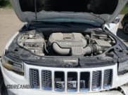 ✅ 2014 Jeep Grand Cherokee Summit • VIN: 1C4RJFJG2EC214092 • Lot: 70781765. Listed on Copart with 235,693 mi. Free auction sales archive from the USA and detailed vehicle history report at DreamBid. Image 12.