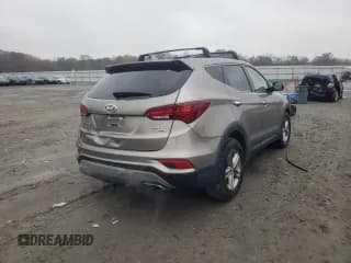 ✅ 2018 Hyundai Santa Fe 2.4L • VIN: 5XYZUDLB7JG570721 • Лот: 67084972. Опубликован ранее на Copart с пробегом 51 327 миль. Бесплатный доступ к архиву аукционных продаж из США и подробный отчёт об истории автомобиля на DreamBid. Изображение 3.