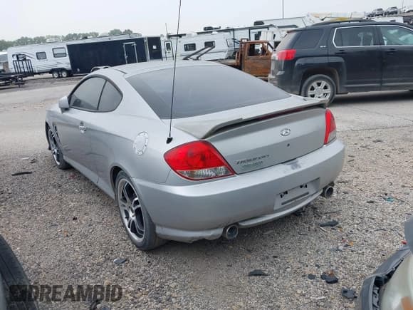 ✅ 2005 Hyundai Tiburon GS • VIN: KMHHM65D85U174335 • Лот: 39373771. Опубликован ранее на IAAI с пробегом 117 296 миль. Бесплатный доступ к архиву аукционных продаж из США и подробный отчёт об истории автомобиля на DreamBid. Изображение 3.