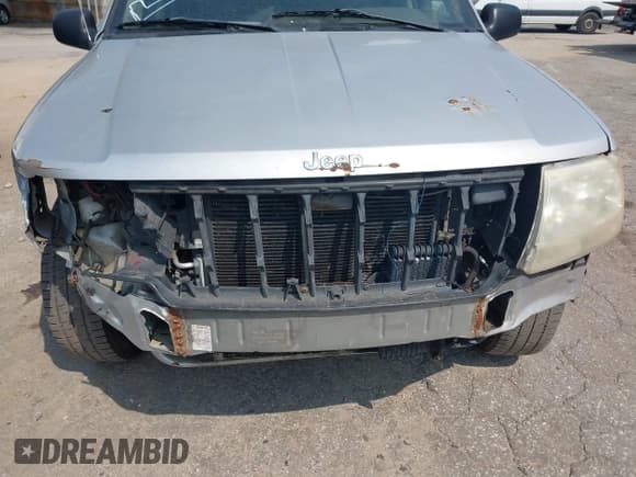 ✅ 2004 Jeep Grand Cherokee Laredo • VIN: 1J4GX48S74C165095 • Lot: 42306475. Listed on IAAI with 238,560 mi. Free auction sales archive from the USA and detailed vehicle history report at DreamBid. Image 14.