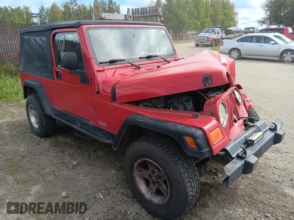 ✅ 2005 Jeep Wrangler Unlimited • VIN: 1J4FA44S15P312587 • Lot: 68176985. Listed on Copart with 186,612 mi. Free auction sales archive from the USA and detailed vehicle history report at DreamBid. Image 4.