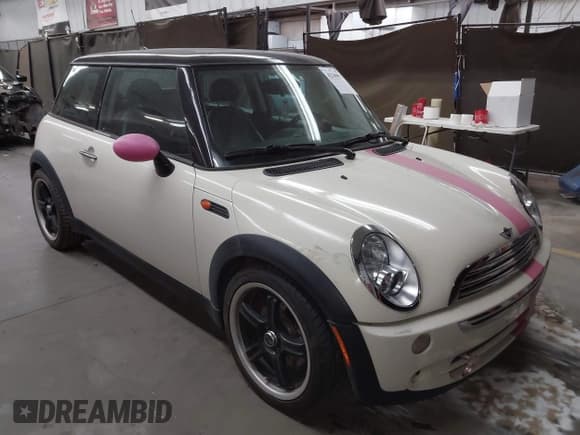 ✅ 2006 MINI Hardtop • VIN: WMWRC33506TK15034 • Lot: 42349957. Listed on IAAI with 153,596 mi. Free auction sales archive from the USA and detailed vehicle history report at DreamBid. Image 1.