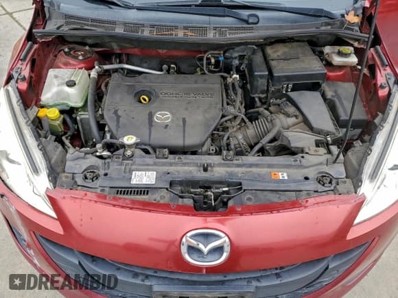 ✅ 2015 Mazda 5 Sport • VIN: JM1CW2BL7F0184828 • Лот: 94140455. Опубликован ранее на Copart с пробегом 94 378 миль. Бесплатный доступ к архиву аукционных продаж из США и подробный отчёт об истории автомобиля на DreamBid. Изображение 12.