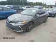 2022 Toyota Camry Hybrid XLE with VIN 4T1F31AK6NU575433, listed as a IAAI auction lot 42841689 with 65,526 mi miles and . Bid and sale history available at DreamBid. Image 2.