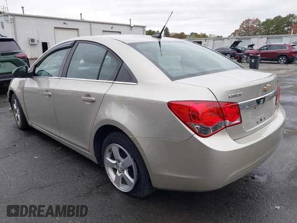 ✅ 2013 Chevrolet Cruze 1LT • VIN: 1G1PC5SBXD7147918 • Lot: 43573003. Listed on IAAI with 79,414 mi. Free auction sales archive from the USA and detailed vehicle history report at DreamBid. Image 3.