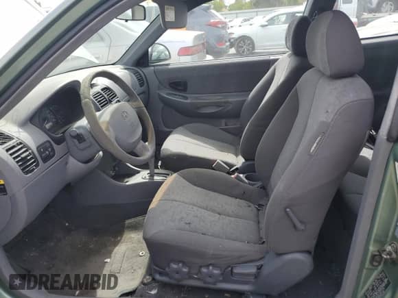 2003 Hyundai Accent GL с VIN KMHCG35C13U277732, выставлен на аукционе Copart как лот 72276634 с пробегом 135 176 миль миль и Списание • Salvage title. История ставок и продаж доступна на DreamBid. Изображение 7.