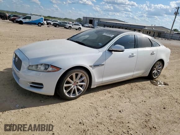 ✅ 2014 Jaguar XJ • VIN: SAJWA1CZ2E8V59275 • Лот: 68568925. Опубликован ранее на Copart с пробегом 74 696 миль. Бесплатный доступ к архиву аукционных продаж из США и подробный отчёт об истории автомобиля на DreamBid. Изображение 1.