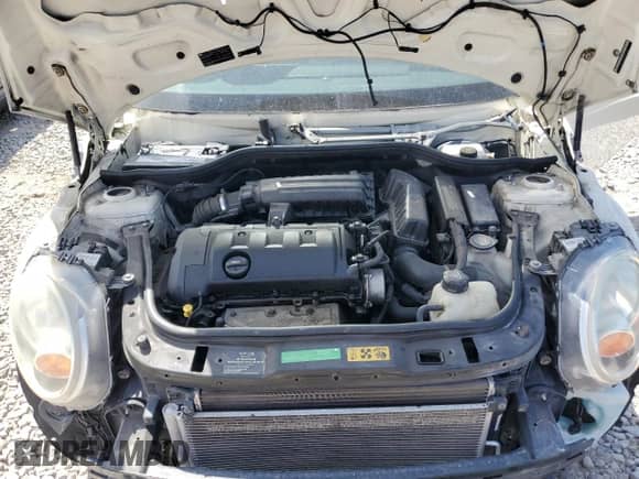 2009 MINI Hardtop with VIN WMWMF33539TT69081, listed as a Copart auction lot 58087205 with 106,470 mi miles and Salvage title. Bid and sale history available at DreamBid. Image 11.