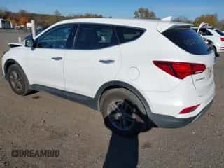 2017 Hyundai Santa Fe 2.4L z VIN 5XYZTDLB9HG396986, wystawiony jako IAAI lot #43523683 z przebiegiem 83 426 mil mil oraz . Historia ofert i sprzedaży dostępna na DreamBid. Obrazek 3.