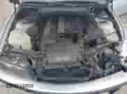 2000 BMW 3 Series 323i with VIN WBAAM3335YCA86464, listed as a Copart auction lot 61687574 with 151,447 mi miles and Salvage title. Bid and sale history available at DreamBid. Image 11.