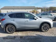 ✅ 2016 Mazda CX-5 Grand Touring • VIN: JM3KE2DY8G0604998 • Lot: 43696169. Listed on IAAI with 104,349 mi. Free auction sales archive from the USA and detailed vehicle history report at DreamBid. Image 13.