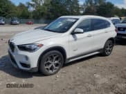 ✅ 2018 BMW X1 xDrive28i • VIN: WBXHT3C34J5F89498 • Lot: 84041505. Listed on Copart with 74,145 mi. Free auction sales archive from the USA and detailed vehicle history report at DreamBid. Image 1.