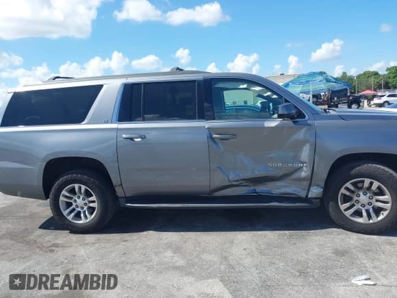 ✅ 2020 Chevrolet Suburban LT • VIN: 1GNSCHKC4LR302047 • Lot: 42518927. Listed on IAAI with 105,760 mi. Free auction sales archive from the USA and detailed vehicle history report at DreamBid. Image 13.
