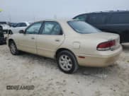 ✅ 1995 Mazda 626 • VIN: 1YVGE22D0S5352815 • Lot: 43770435. Listed on Copart with 112,171 mi. Free auction sales archive from the USA and detailed vehicle history report at DreamBid. Image 2.