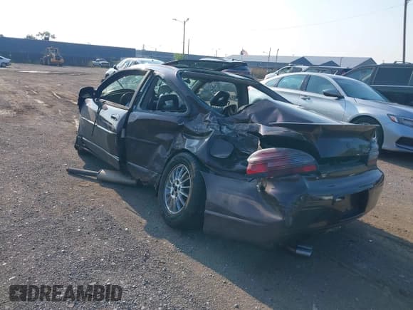 ✅ 2002 Pontiac Grand Prix GTP • VIN: 1G2WR121X2F213750 • Lot: 42981975. Listed on IAAI with 156,049 mi. Free auction sales archive from the USA and detailed vehicle history report at DreamBid. Image 3.