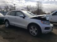 ✅ 2013 Volkswagen Touareg Exec • VIN: WVGEF9BP6DD011274 • Lot: 50680105. Listed on Copart with 96,336 mi. Free auction sales archive from the USA and detailed vehicle history report at DreamBid. Image 4.