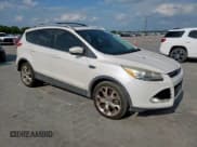 ✅ 2013 Ford Escape Titanium • VIN: 1FMCU0J90DUC13426 • Lot: 53643565. Listed on Copart with 176,600 mi. Free auction sales archive from the USA and detailed vehicle history report at DreamBid. Image 4.