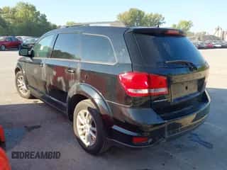 2014 Dodge Journey SXT z VIN 3C4PDCBB0ET124864, wystawiony jako IAAI lot #43333855 z przebiegiem 208 280 mil mil oraz . Historia ofert i sprzedaży dostępna na DreamBid. Obrazek 3.