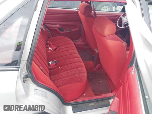 ✅ 1991 Ford Tempo • VIN: 1FAPP36X1MK176653 • Lot: 42181128. Listed on IAAI with 11,582 mi. Free auction sales archive from the USA and detailed vehicle history report at DreamBid. Image 8.