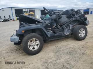 2012 Jeep Wrangler Sport with VIN 1C4AJWAG7CL256736, listed as a Copart auction lot 67436265 with 99,999 mi miles and Salvage title. Bid and sale history available at DreamBid. Image 1.