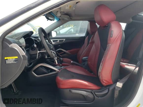 2012 Hyundai Veloster w/Red Int z VIN KMHTC6AD4CU055889, wystawiony jako Copart lot #62264394 z przebiegiem 138 504 mil mil oraz Szkoda całkowita • Salvage title. Historia ofert i sprzedaży dostępna na DreamBid. Obrazek 7.