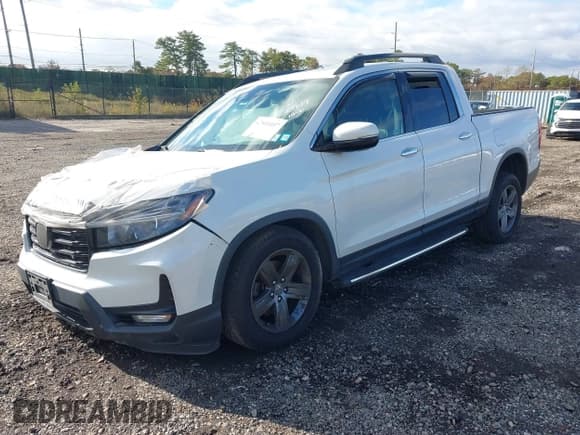 ✅ 2022 Honda Ridgeline RTL-E • VIN: 5FPYK3F70NB002186 • Lot: 43151037. Listed on IAAI with 106,821 mi. Free auction sales archive from the USA and detailed vehicle history report at DreamBid. Image 2.
