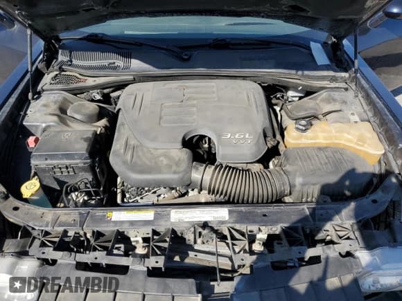 ✅ 2012 Dodge Challenger SXT Plus • VIN: 2C3CDYAG6CH124824 • Лот: 90899325. Опубликован ранее на Copart с пробегом 128 236 миль. Бесплатный доступ к архиву аукционных продаж из США и подробный отчёт об истории автомобиля на DreamBid. Изображение 11.