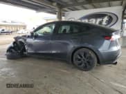 ✅ 2025 Tesla Model Y Long Range • VIN: 7SAYGDED0SF267132 • Lot: 84027995. Listed on Copart with 14,878 mi. Free auction sales archive from the USA and detailed vehicle history report at DreamBid. Image 2.