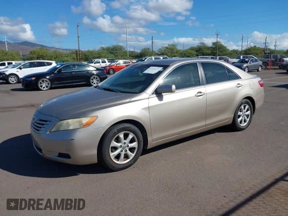 ✅ 2007 Toyota Camry LE • VIN: JTNBK46K573004570 • Лот: 41333271. Опубликован ранее на IAAI с пробегом 125 671 миль. Бесплатный доступ к архиву аукционных продаж из США и подробный отчёт об истории автомобиля на DreamBid. Изображение 2.