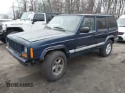 ✅ 2001 Jeep Cherokee Sport • VIN: 1J4FF48SX1L620872 • Lot: 43894063. Listed on IAAI with 164,586 mi. Free auction sales archive from the USA and detailed vehicle history report at DreamBid. Image 2.