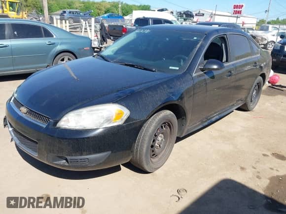 2013 Chevrolet Impala Police with VIN 2G1WD5E31D1256682, listed as a IAAI auction lot 42276990 with 148,251 mi miles and . Bid and sale history available at DreamBid. Image 18.