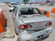 ✅ 1999 Toyota Corolla VE • VIN: 1NXBR12E2XZ214726 • Lot: 43005806. Listed on IAAI with 295,368 mi. Free auction sales archive from the USA and detailed vehicle history report at DreamBid. Image 6.