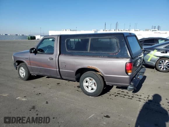 ✅ 1997 Mazda B-Series • VIN: 4F4CR12A2VTM24064 • Lot: 88822475. Listed on Copart with 222,927 mi. Free auction sales archive from the USA and detailed vehicle history report at DreamBid. Image 2.