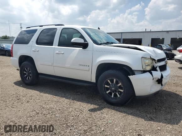 2007 Chevrolet Tahoe LTZ с VIN 1GNFK13097J255473, выставлен на аукционе Copart как лот 68166135 с пробегом 168 573 миль миль и Списание • Salvage title. История ставок и продаж доступна на DreamBid. Изображение 4.