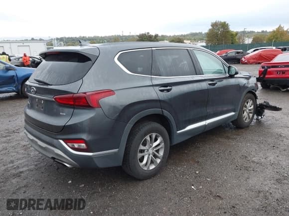 ✅ 2020 Hyundai Santa Fe SEL • VIN: 5NMS3CAD4LH202833 • Лот: 43434662. Опубликован ранее на IAAI с пробегом 76 924 миль. Бесплатный доступ к архиву аукционных продаж из США и подробный отчёт об истории автомобиля на DreamBid. Изображение 4.