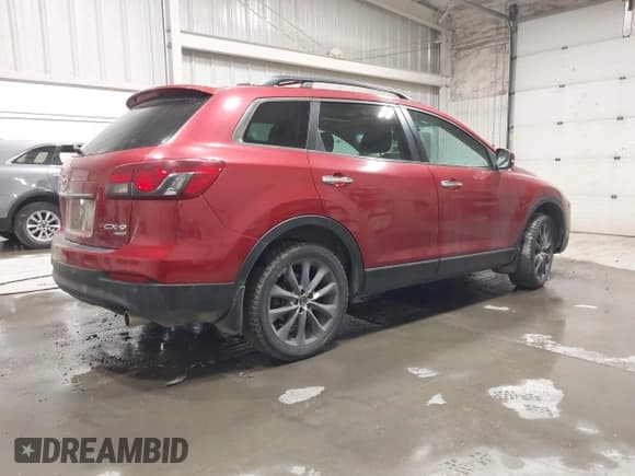 ✅ 2015 Mazda CX-9 Grand Touring • VIN: JM3TB3DAXF0464215 • Лот: 42043092. Опубликован ранее на IAAI с пробегом 119 269 миль. Бесплатный доступ к архиву аукционных продаж из США и подробный отчёт об истории автомобиля на DreamBid. Изображение 4.