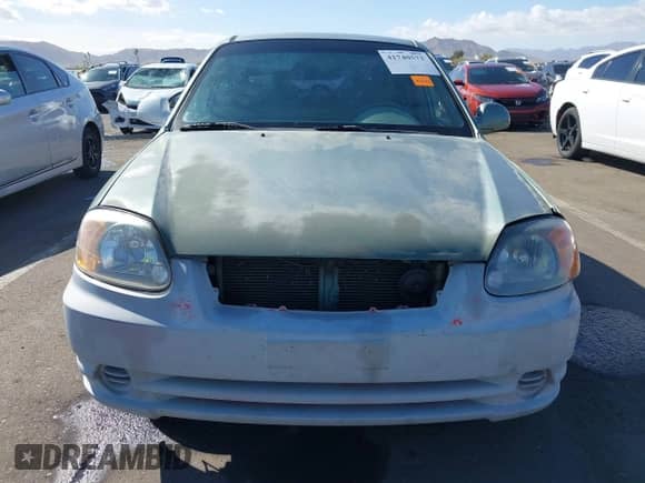 2005 Hyundai Accent GLS z VIN KMHCG45C95U620716, wystawiony jako IAAI lot #41740573 z przebiegiem 187 971 mil mil oraz . Historia ofert i sprzedaży dostępna na DreamBid. Obrazek 13.