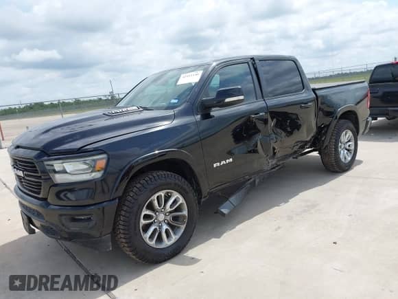2020 Ram 1500 Laramie with VIN 1C6RREJT2LN295149, listed as a IAAI auction lot 42411146 with 113,445 mi miles and . Bid and sale history available at DreamBid. Image 2.