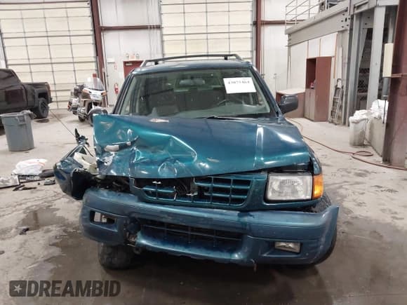 ✅ 1998 Isuzu Rodeo S • VIN: 4S2CK58W4W4337404 • Lot: 43075464. Listed on IAAI with 235,177 mi. Free auction sales archive from the USA and detailed vehicle history report at DreamBid. Image 12.