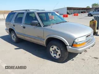 2003 Chevrolet Blazer LS z VIN 1GNDT13X63K146670, wystawiony jako IAAI lot #42200426 z przebiegiem 129 516 mil mil oraz . Historia ofert i sprzedaży dostępna na DreamBid. Obrazek 1.