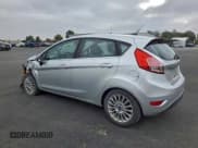 ✅ 2014 Ford Fiesta Titanium • VIN: 3FADP4FJXEM206277 • Lot: 95773415. Wystawiony na Copart z przebiegiem 94 744 mil. Bezpłatny archiwum sprzedaży aukcyjnych z USA i szczegółowy raport historii pojazdu na DreamBid. Zdjęcie 2.