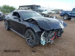 ✅ 2021 Ford Mustang GT • VIN: 1FA6P8CF7M5116461 • Lot: 43213817. Listed on IAAI with 103,210 mi. Free auction sales archive from the USA and detailed vehicle history report at DreamBid. Image 1.