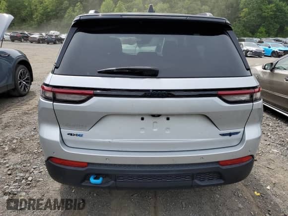 2022 Jeep Grand Cherokee Trailhawk z VIN 1C4RJYC62N8715910, wystawiony jako Copart lot #58785405 z przebiegiem 21 976 mil mil oraz Szkoda całkowita • Salvage title. Historia ofert i sprzedaży dostępna na DreamBid. Obrazek 6.